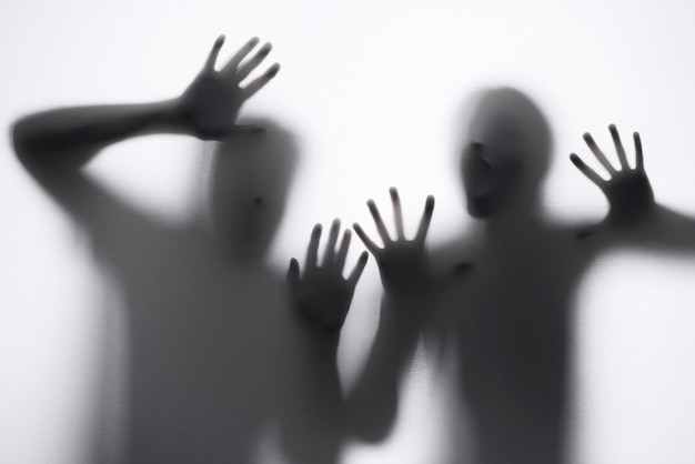 Terrifying hands silhouettes in studio