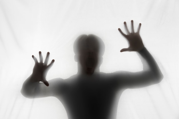 Free photo terrifying hands silhouettes in studio