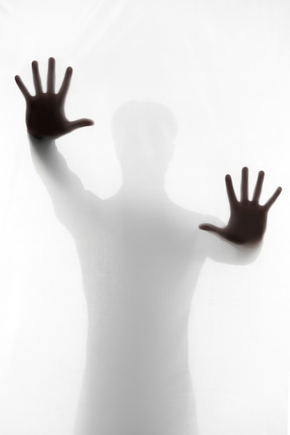 Free Photo terrifying hands silhouettes in studio