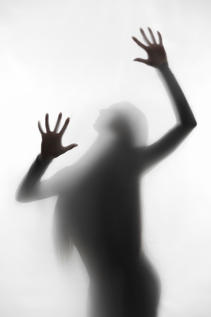 Terrifying hands silhouettes in studio