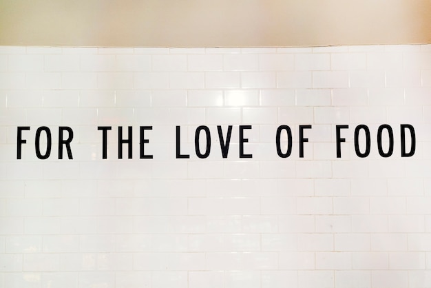 Free photo text for the love of food on white wall