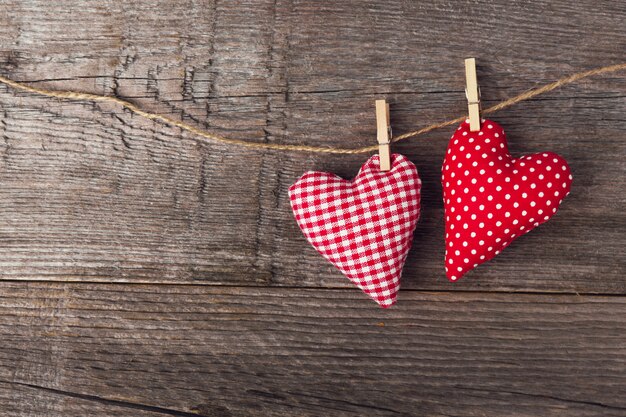 Textile valentines day hearts on wooden