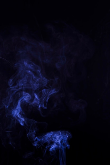 Free Photo texture of blue smoke on black background with copy space