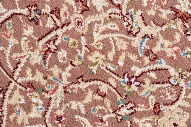 Free photo texture of intricate floral pattern of short pile rug