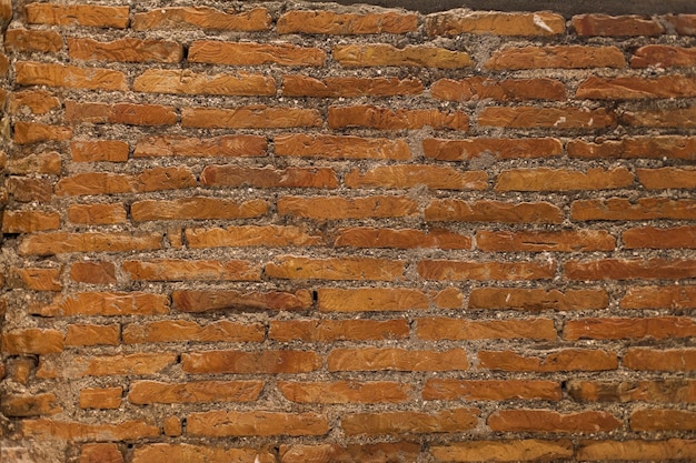 Free photo texture of rough brick wall