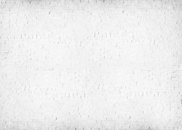 Free photo textured white painted brick wall