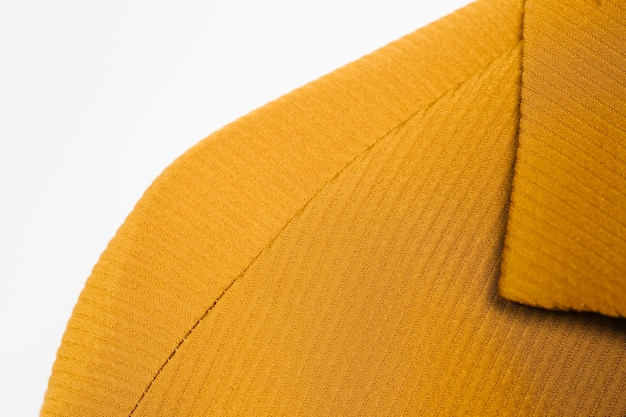 Free photo textured yellow coat close-up