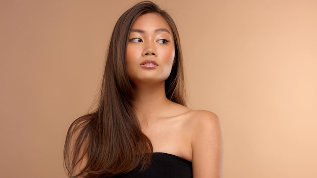 Free photo thai asian model with natural makeup on beige background