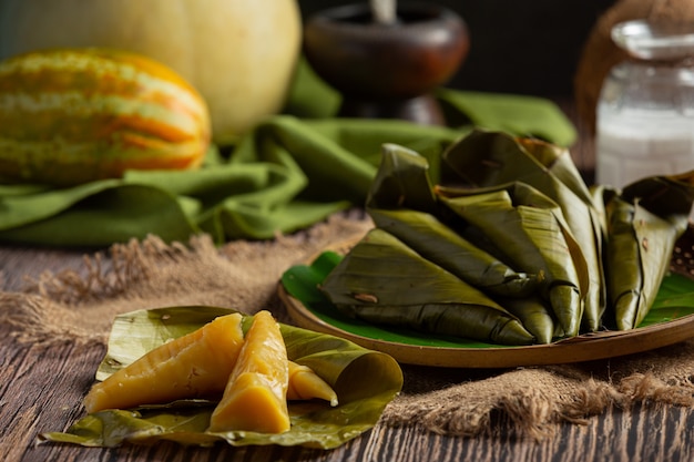 Thai dessert. Cantaloupe steamed pastries wrapped in banana leaf cone