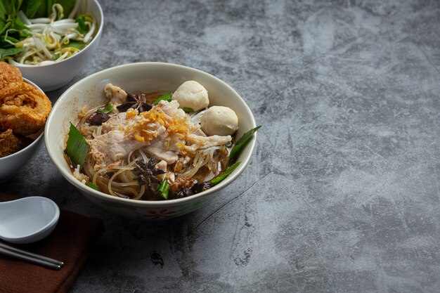 Thai food. Noodles with pork, meatball and vegetable