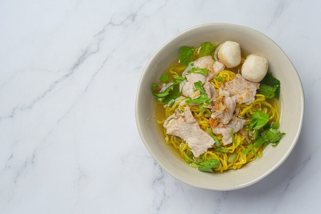 Thai food. Noodles with pork, meatball and vegetable