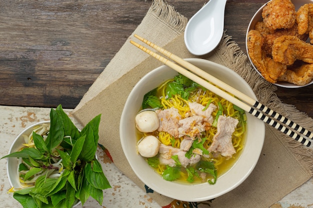 Thai food. Noodles with pork, meatball and vegetable