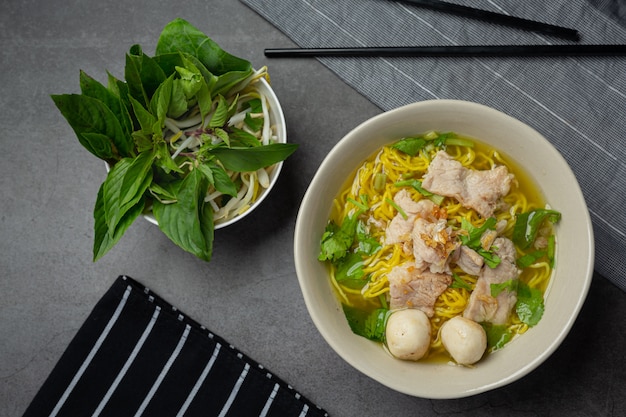 Thai food. Noodles with pork, meatball and vegetable