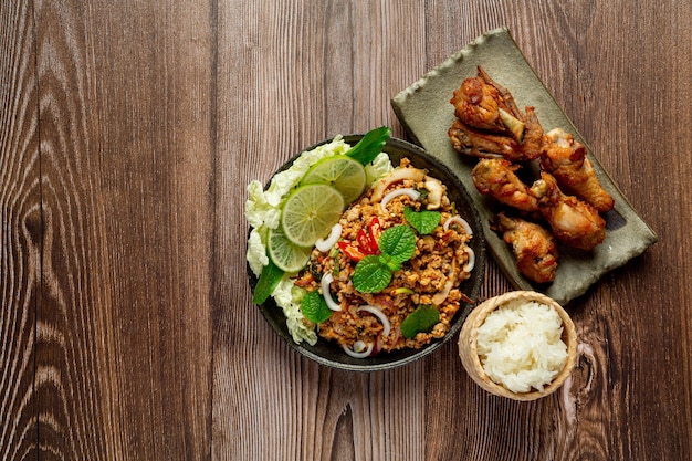 Free Photo thai food with spicy minced pork serve with sticky rice and fried chicken