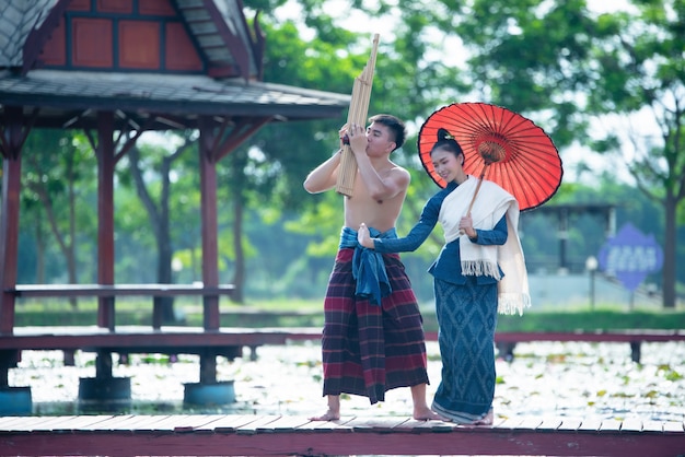 Thailand music, dancing women and man in national style dress costume : thailand dance