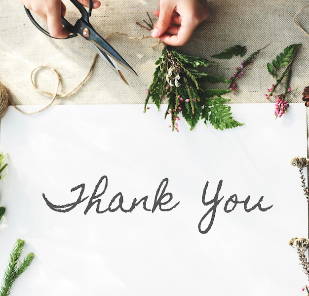 Free photo thank you word with decoration flat lay