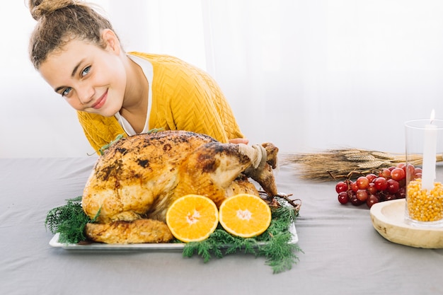 Thanksgiving dishes with woman and turkey