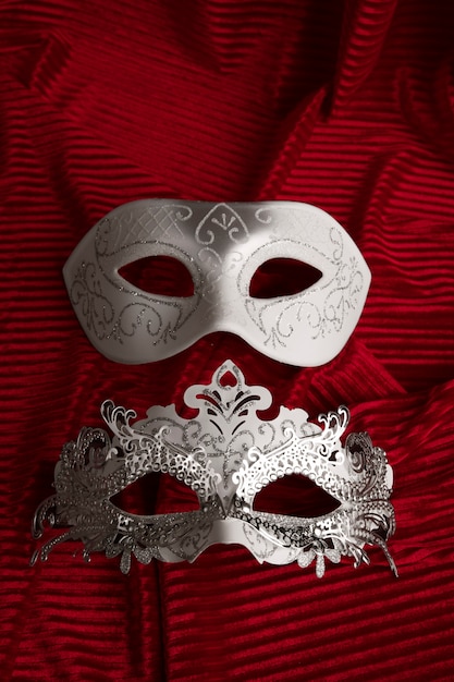 Theater mask on red curtain