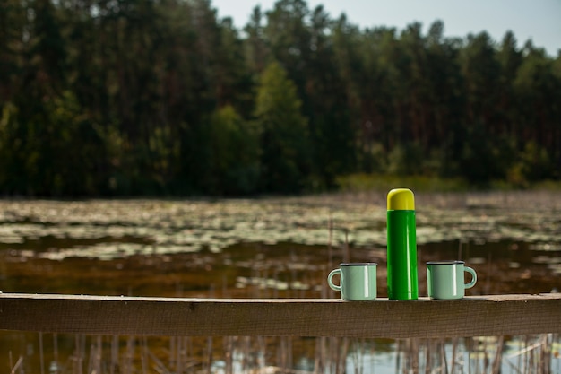 Thermos with two cups copy-space