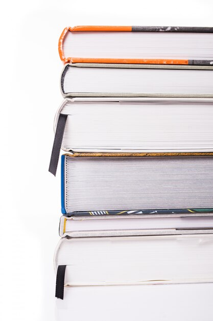 Thick books isolated on a white surface