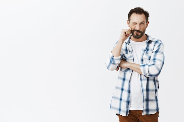 Thoughtful bearded mature man posing