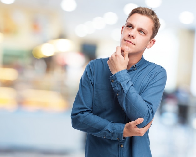 Thoughtful man with a hand on his chin