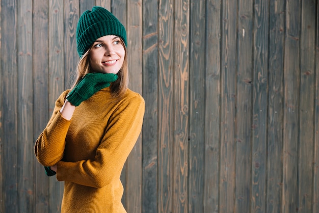 Free photo thoughtful woman in yellow sweater