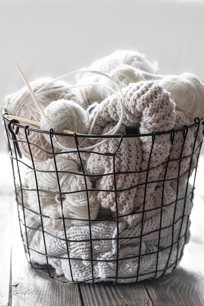 Free photo threads for knitting in the black basket home comfort and hobby background close up