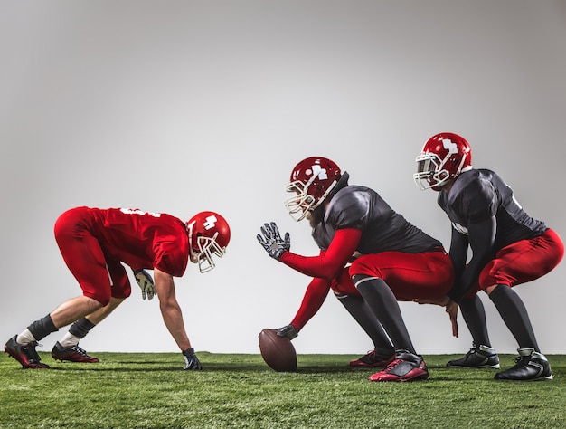 Free photo the three american football players in action