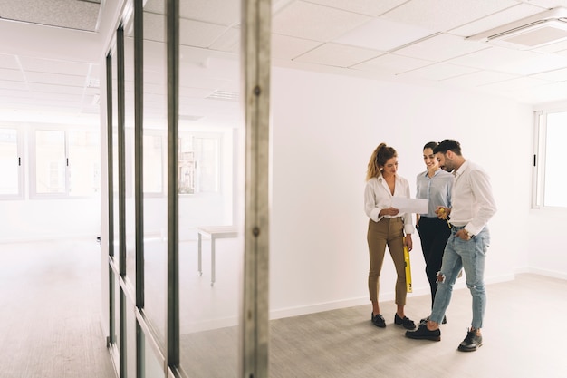 Three business people talking