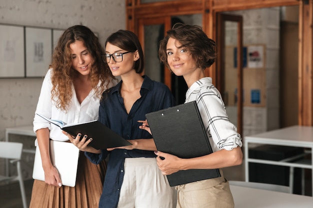 Three business women in co working office