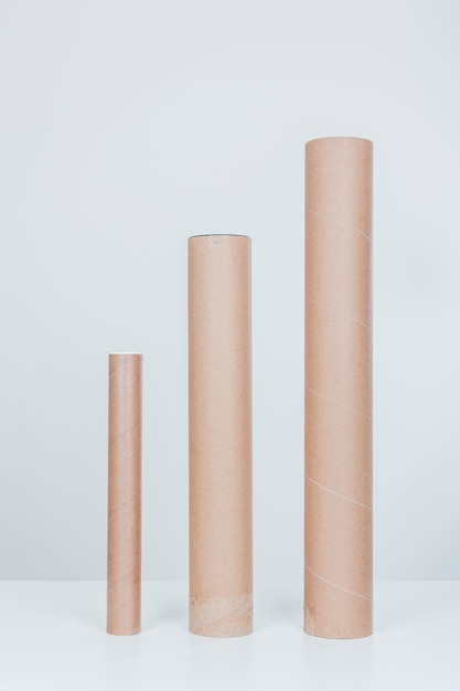 Free photo three cardboard tubes in different sizes