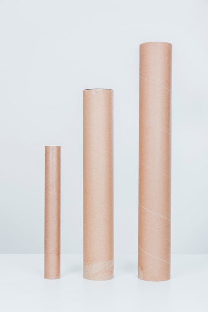 Free photo three cardboard tubes