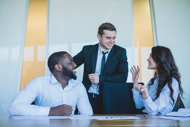 Three co workers talking