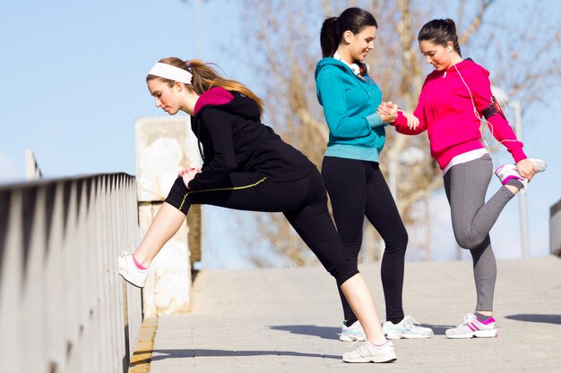 Three friends doing push-ups