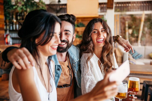 Three friends laughing together