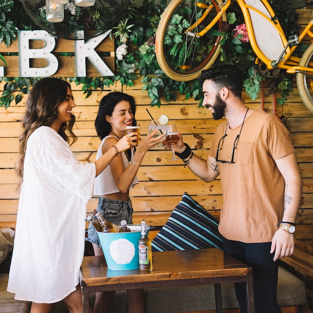 Free photo three friends toasting