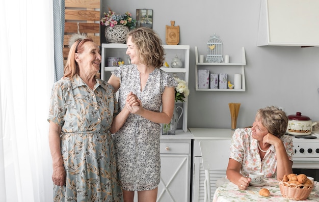 Free photo three generation women in kitchen