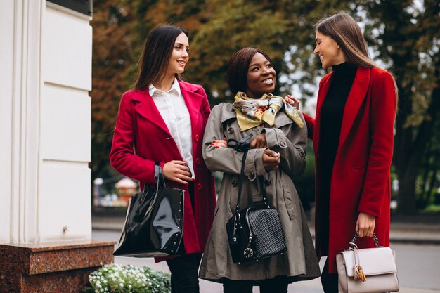 Three multicultural women in the street