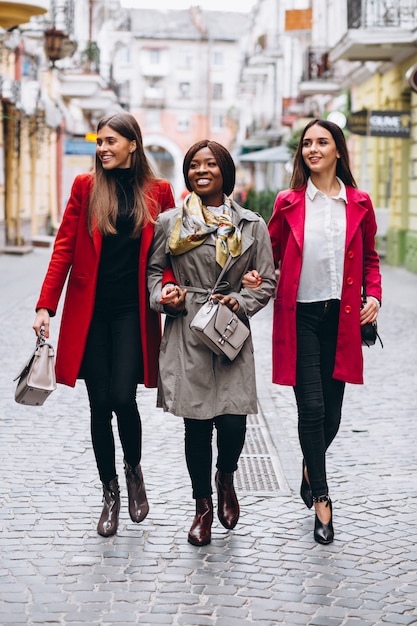 Three multicultural women in the street