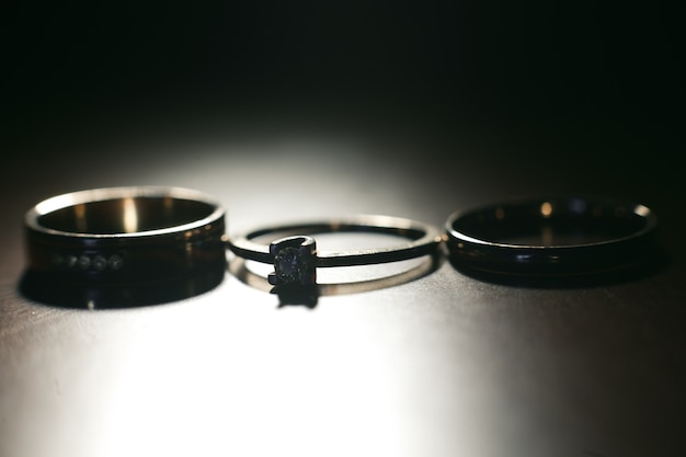 Free photo three nice wedding rings. closeup