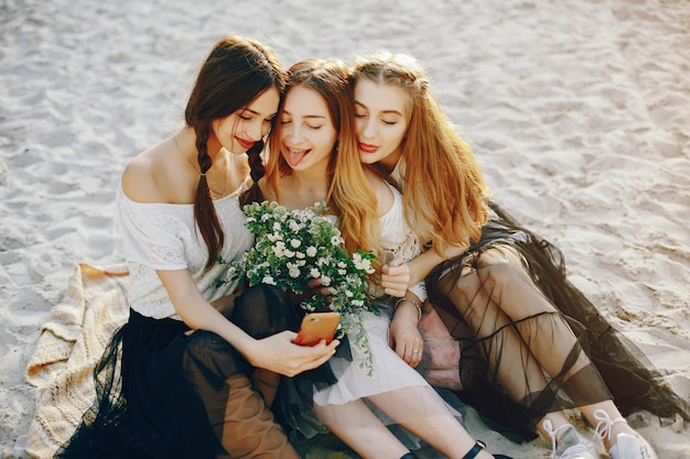 Three pretty girls in a summer park