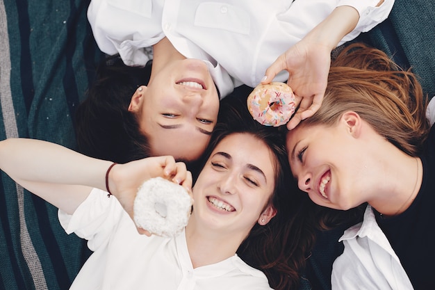 Three pretty girls in a summer park  