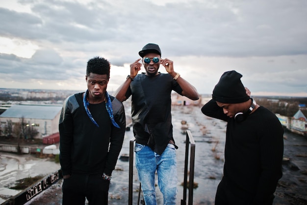 Free Photo three rap singers band on the roof