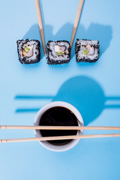 Three sushi rolls on table