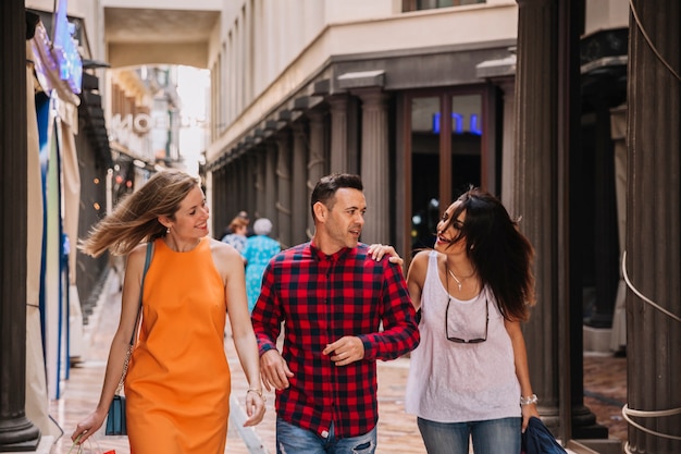 Three young friends shopping