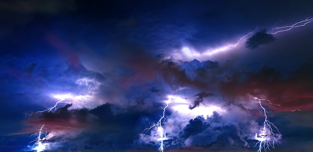 Free photo thunderstorm clouds with lightning at night.