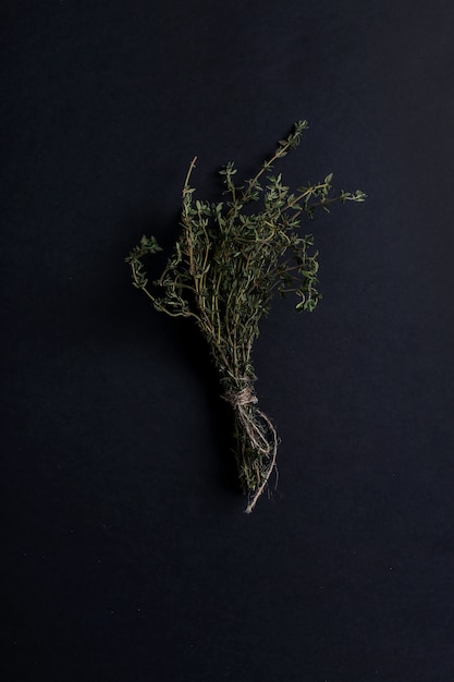 Free Photo thyme herb in black table, top view