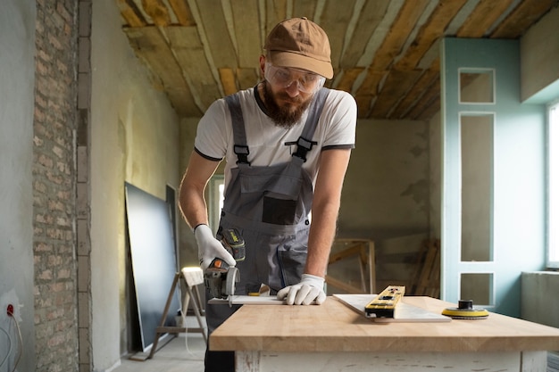 Tiler working on renovation of apartment