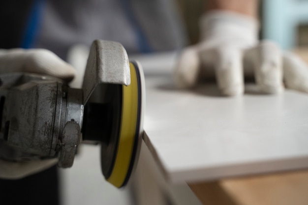 Tiler working on renovation of apartment